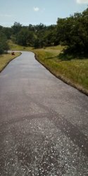 this was an asphalt driveway that I seal coated with commercial Asphalt Sealer with modifiers  