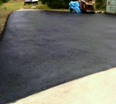 Newly Seal Coated asphalt driveway